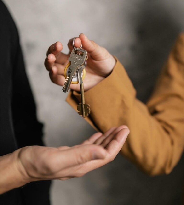 Buyer receiving house keys after property purchase